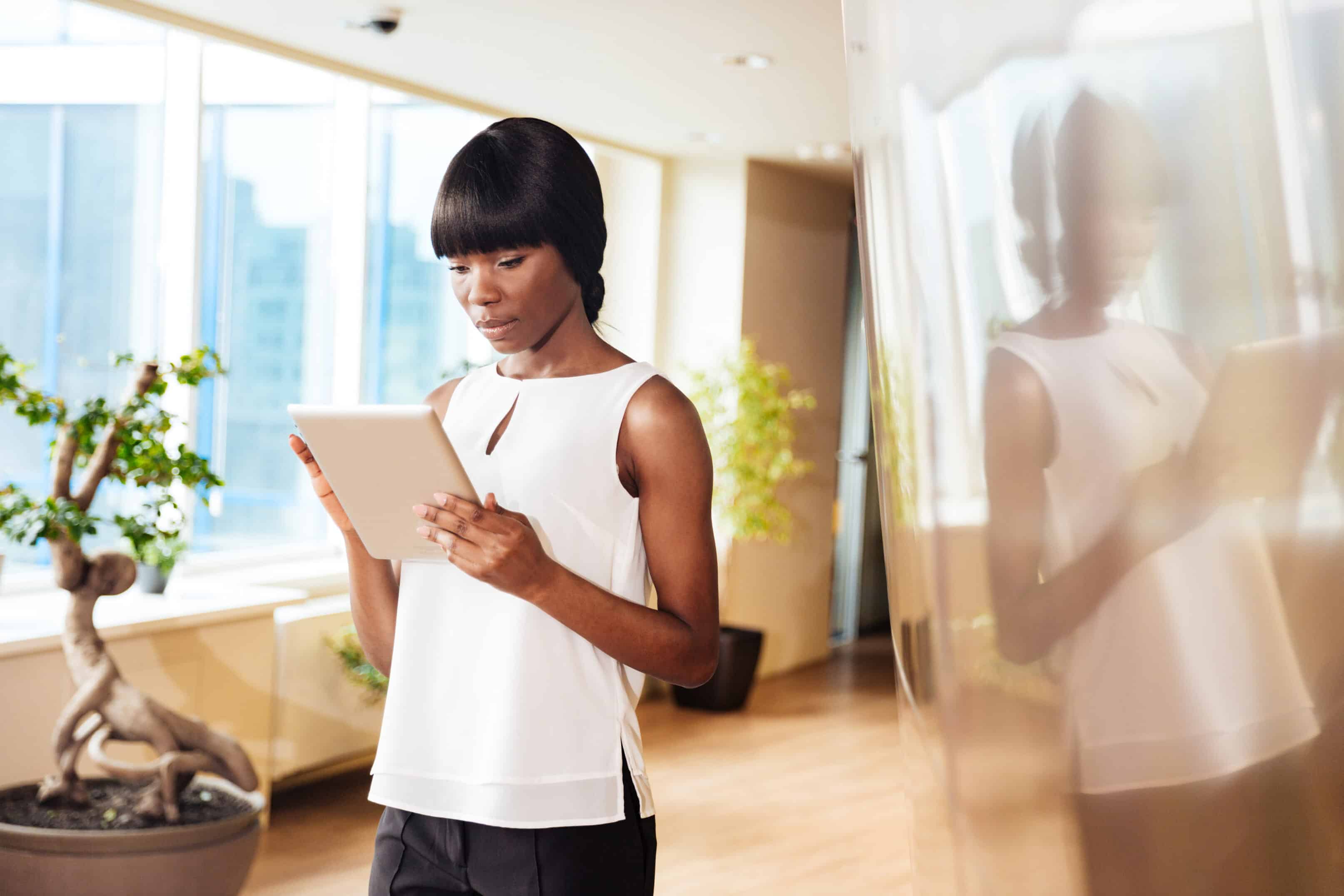 Woman Holding a Tablet Learning How To Choose the Right Bachelor's Degree